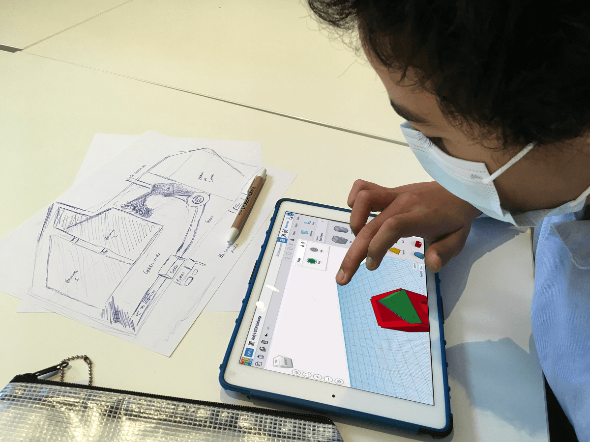 Child working on engineering project on an iPad,